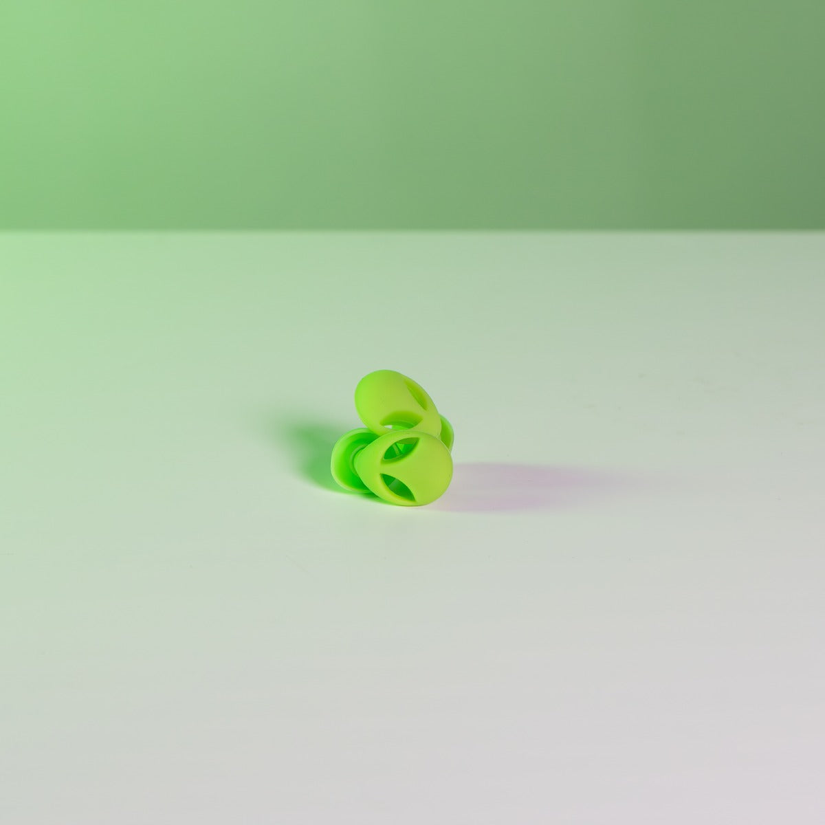 Pair of soft silicone green alien earplugs for concerts and festivals